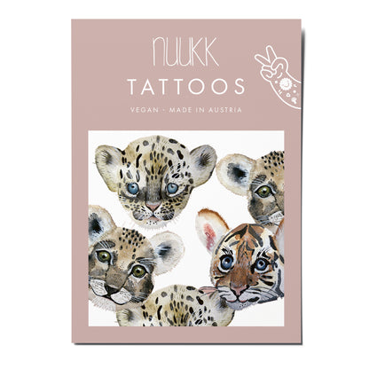 Tattoos von nuukk mit Köpfen von Raubtierbabys in Verpackung.